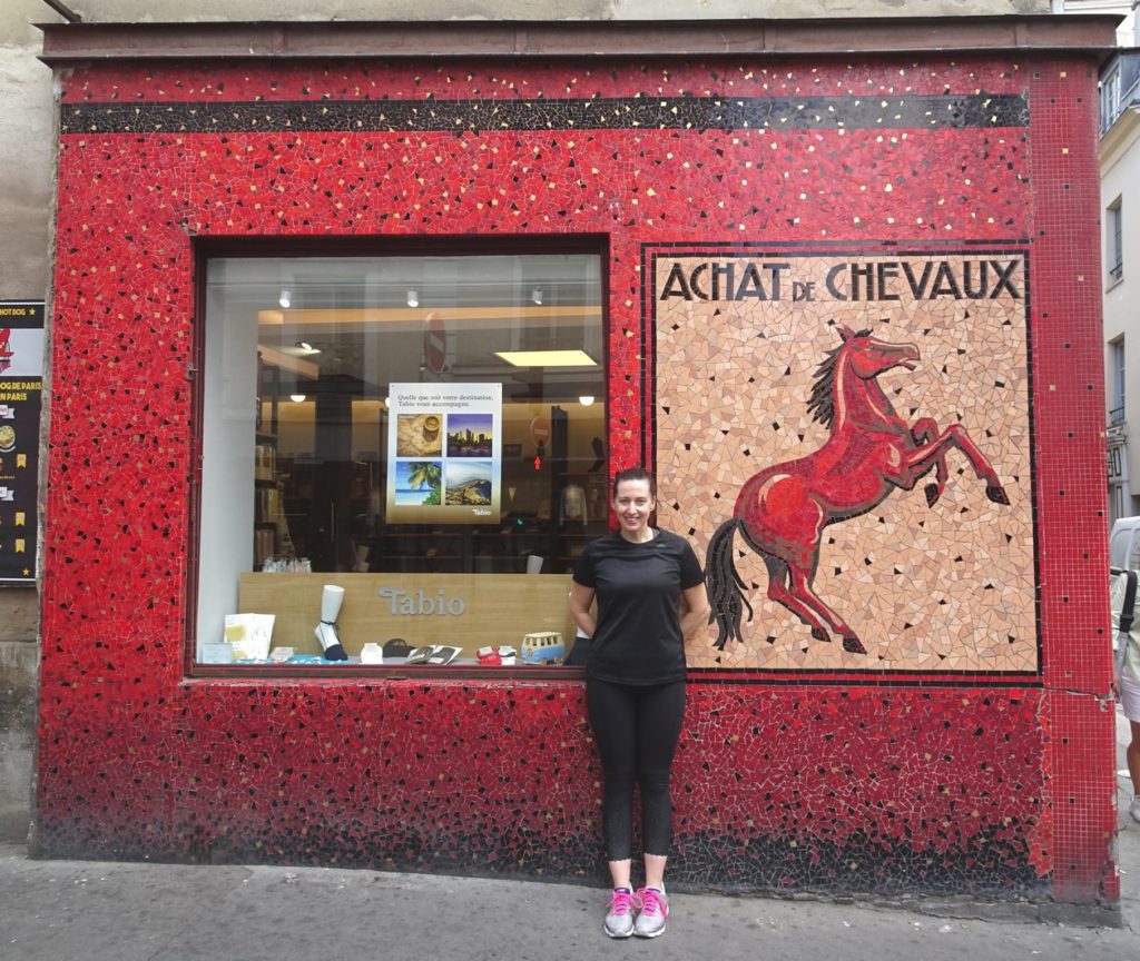 Kristine in front of a fashion store in the Marais